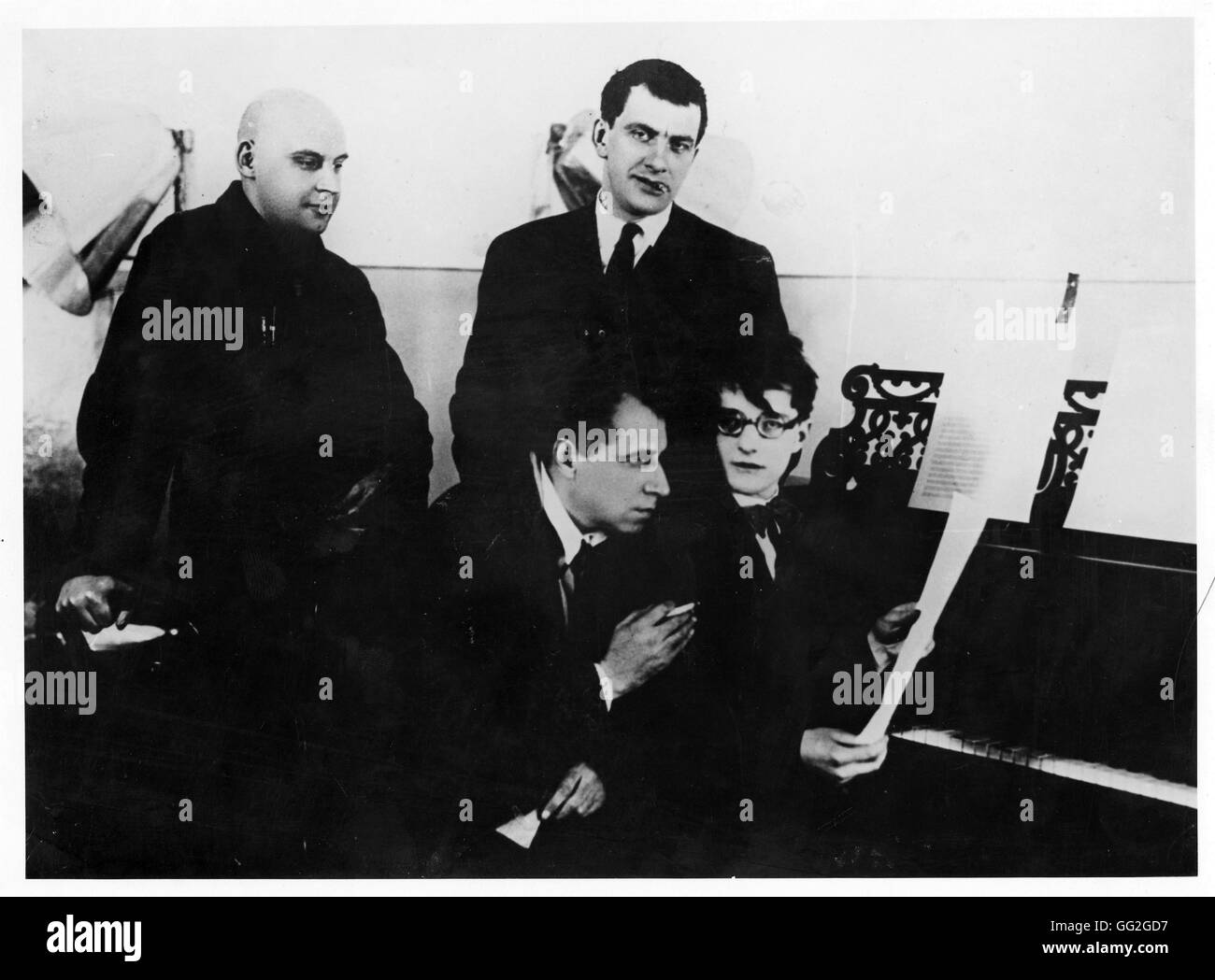 At a rehearsal of 'The Bedbug' in 1929. Seated, Dimitri Shostakovich and Meyerhold. Standing, Vladimir Mayakovsky and Rodchenko. Photograph. Stock Photo