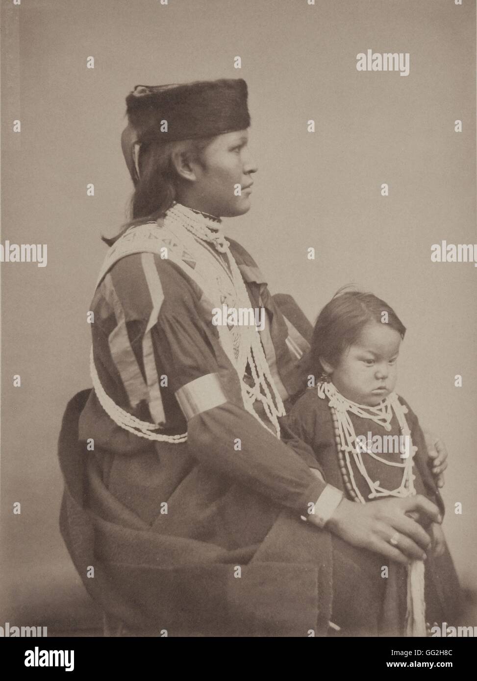 Cat (Ingh-rhanga), from the Omaha Tribe. He's 18, is single. He went in an American school for a few months and later took the name of David Canby. The child beside him is the son of one of his brothers. He's 4 years-old and has no name (according to the Stock Photo