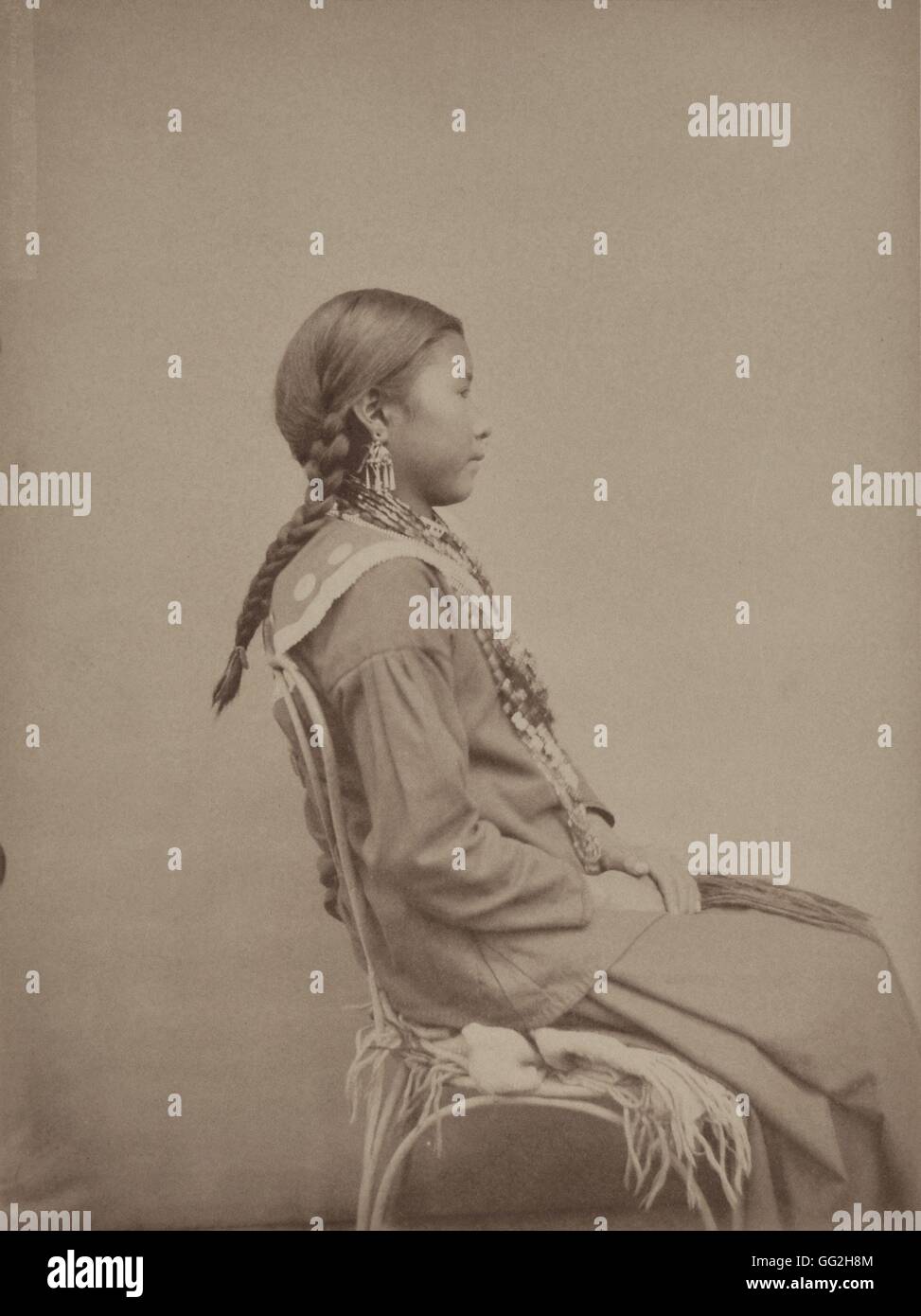 Mik-Tekhe, from the Omaha Tribe. She's 13 and is the first wife of Hard Chief. Photograph in: 'Collection anthropologique du prince Roland Bonaparte : Peaux-rouges' ('Anthropological collection of Roland Bonaparte, Prince of Canino and Musignano: Red Indi Stock Photo