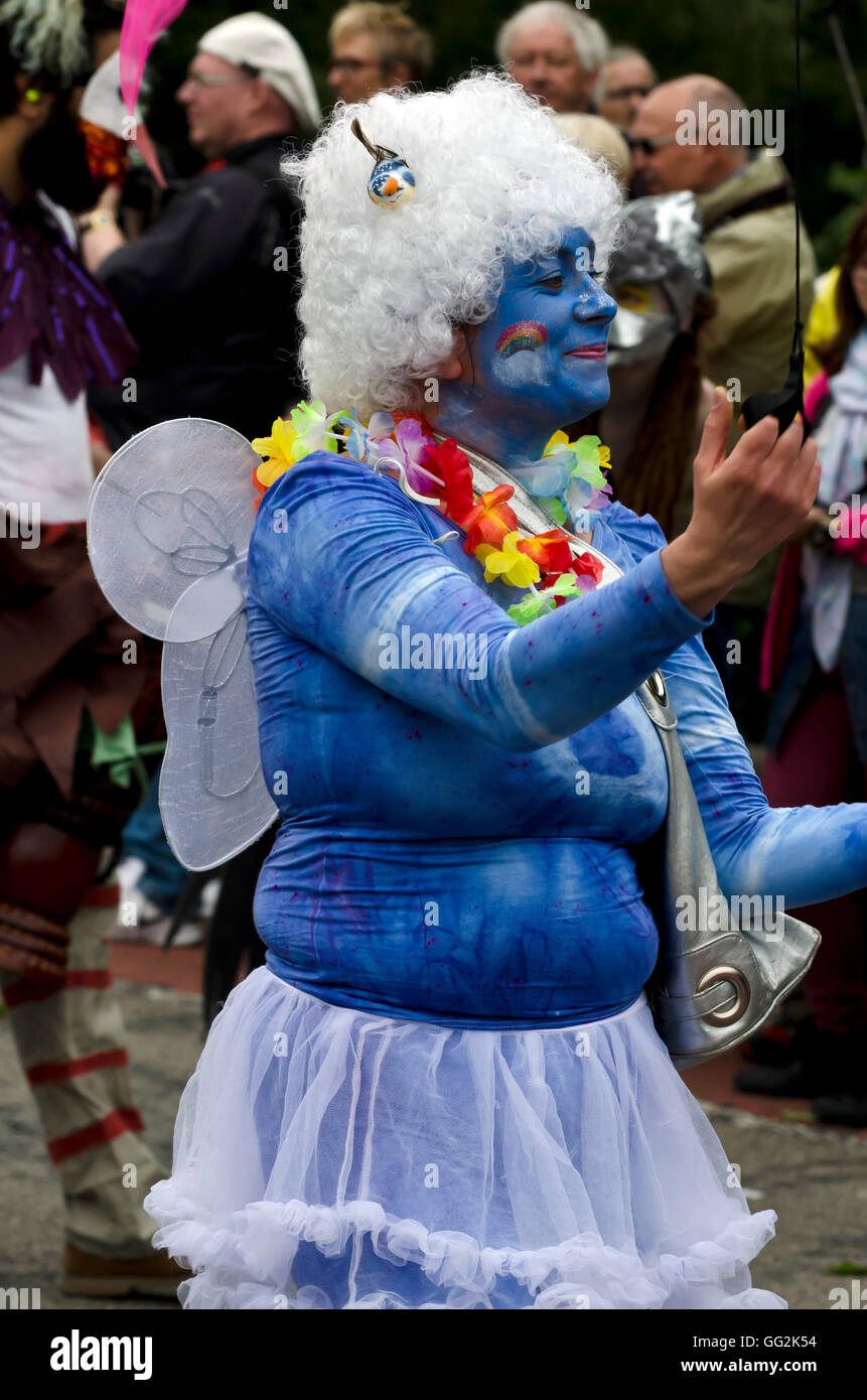 Slightly tubby woman dressed as a blue fairy taking part in the ...