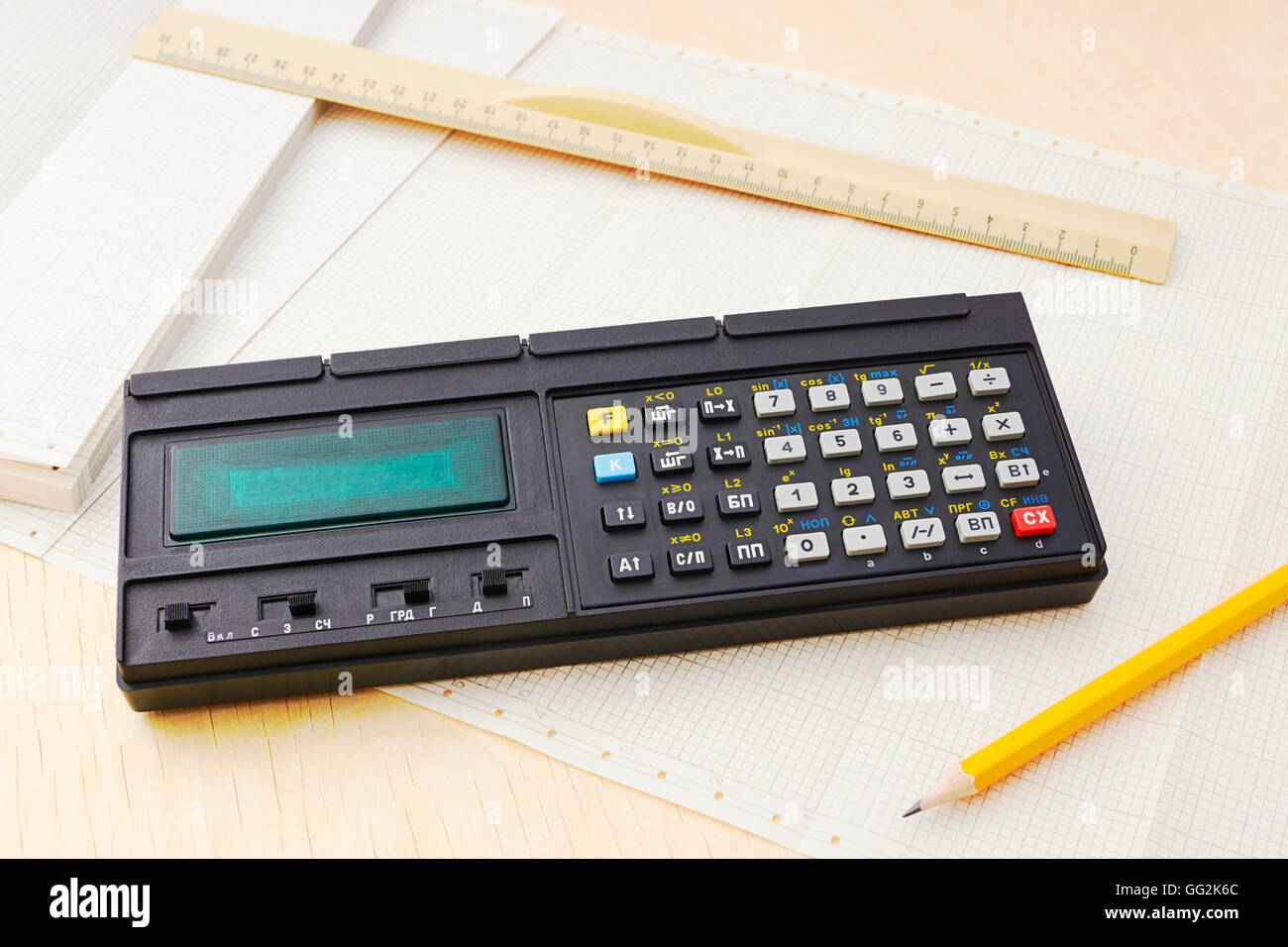 Vintage electronic calculator on diagram paper Stock Photo