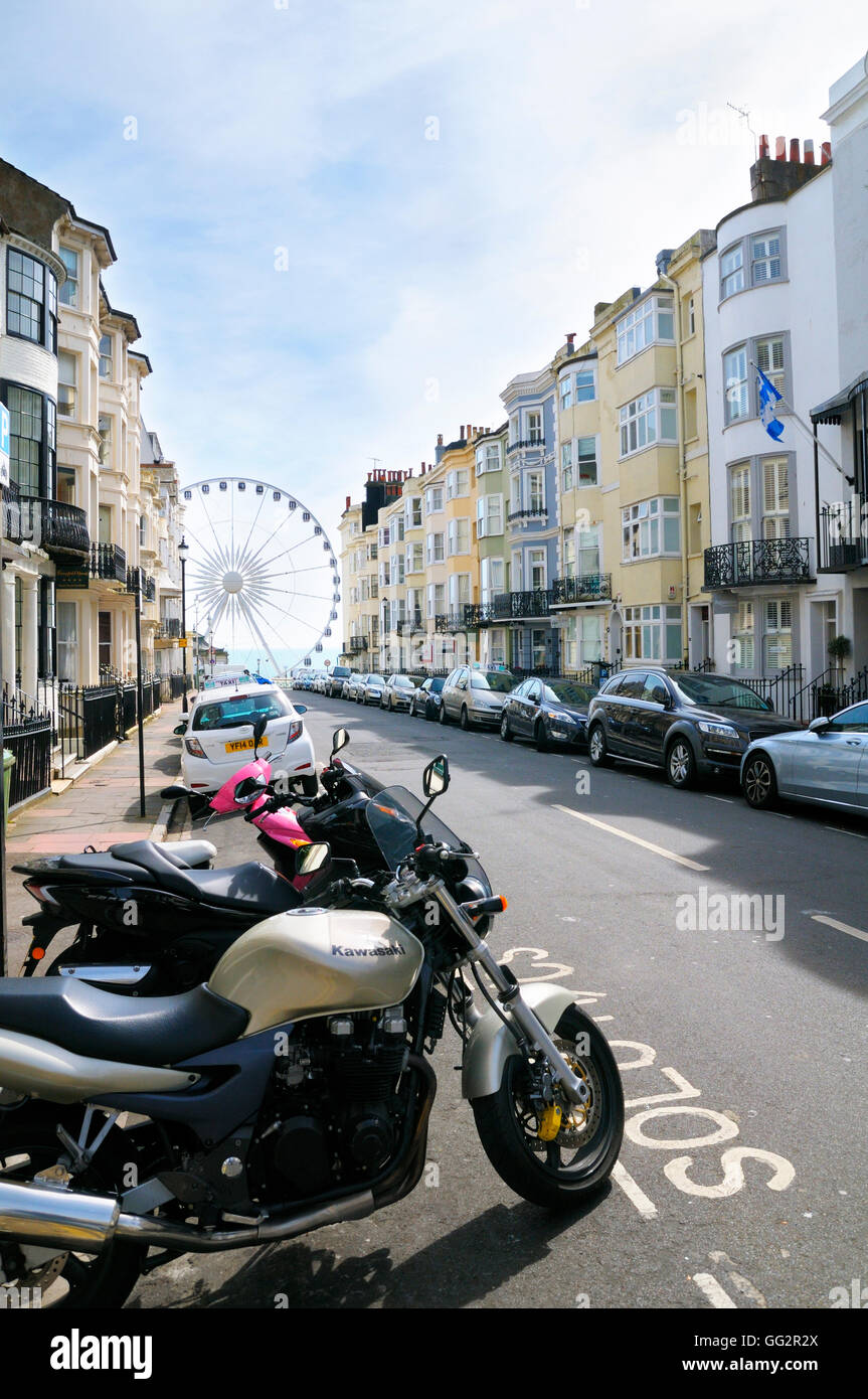 A view down Madeira Place towards Brighton seafront and Big Wheel, Kemp Town, Brighton & Hove, East Sussex, England, UK Stock Photo