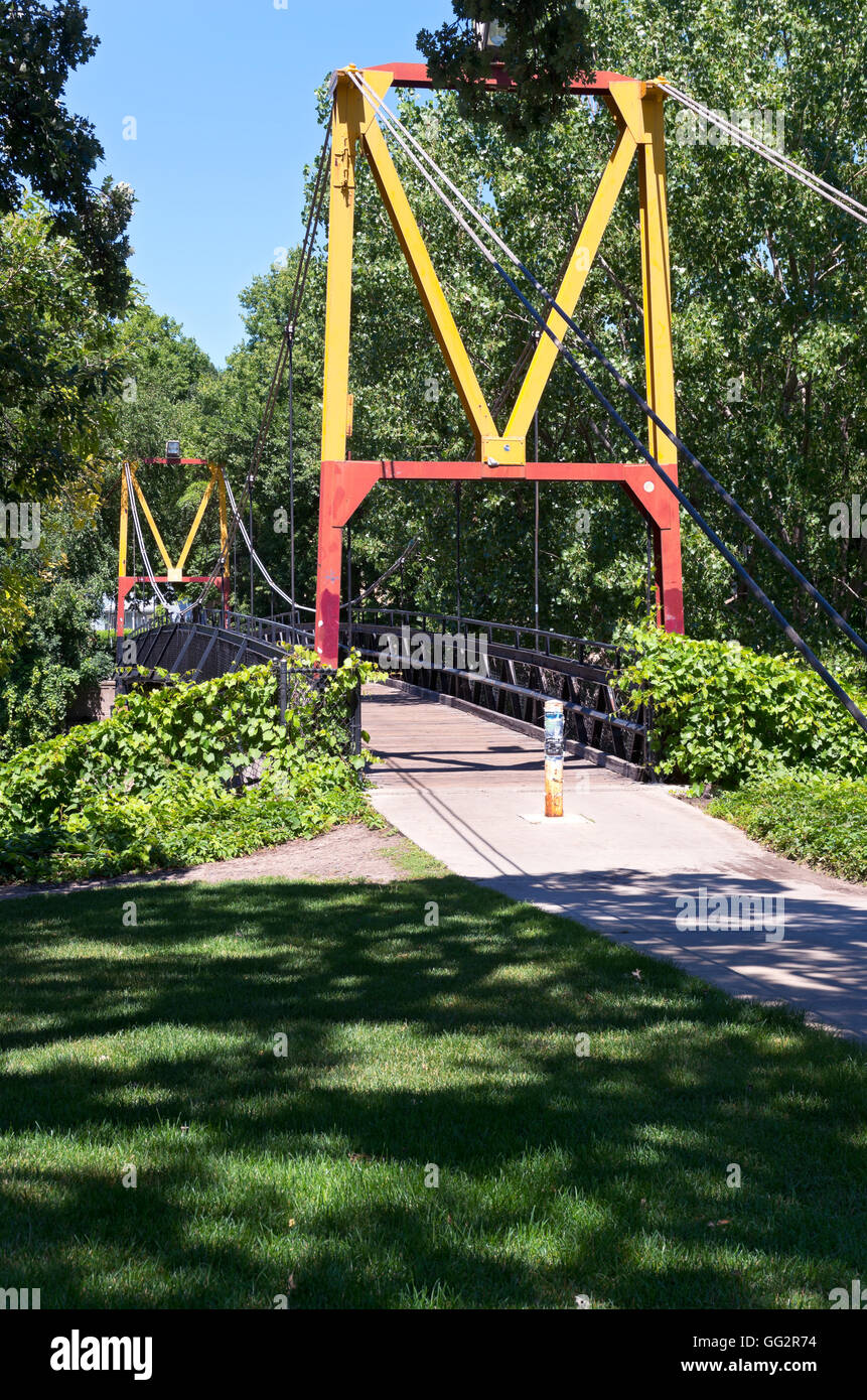 big m suspension footbridge spanning railroad tracks on university of minnesota campus in