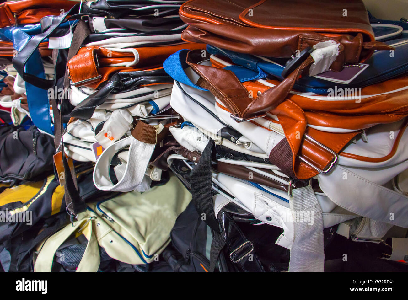 pile of bags on shelves in shop Stock Photo - Alamy