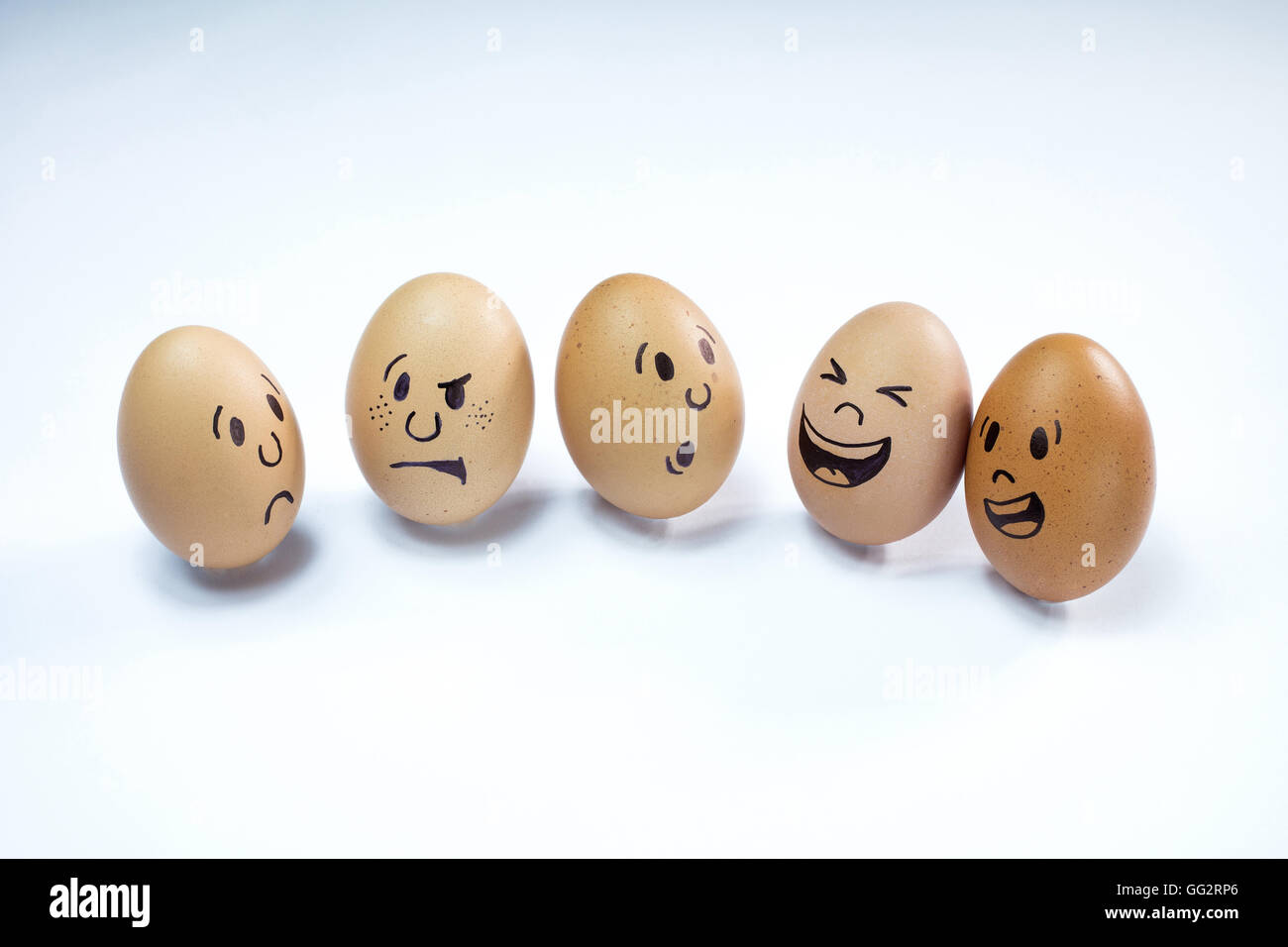 Group of chicken eggs with various emotions Stock Photo