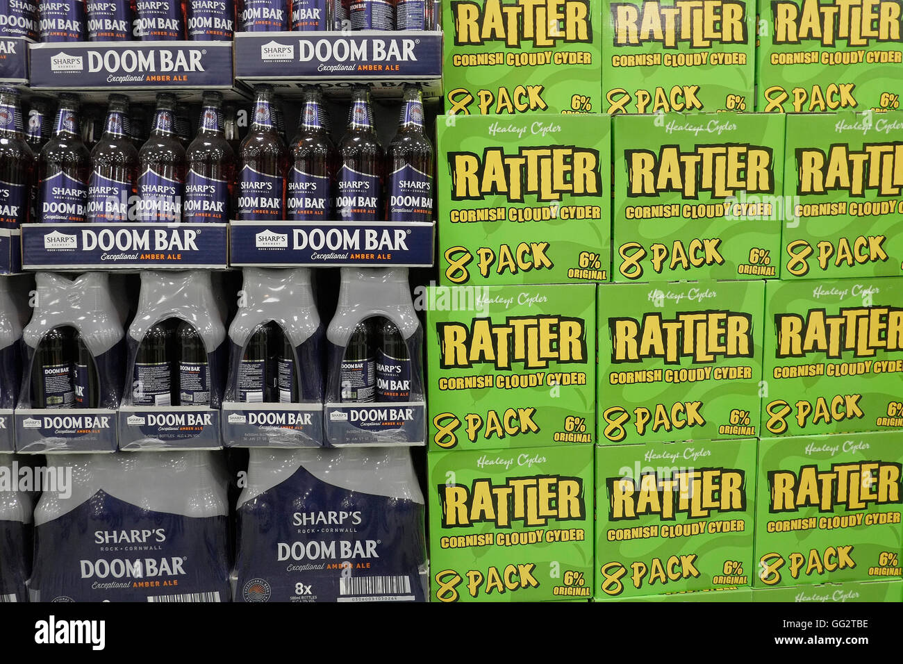 A display of bottles of Rattler cider and Doom Bar beer. Stock Photo