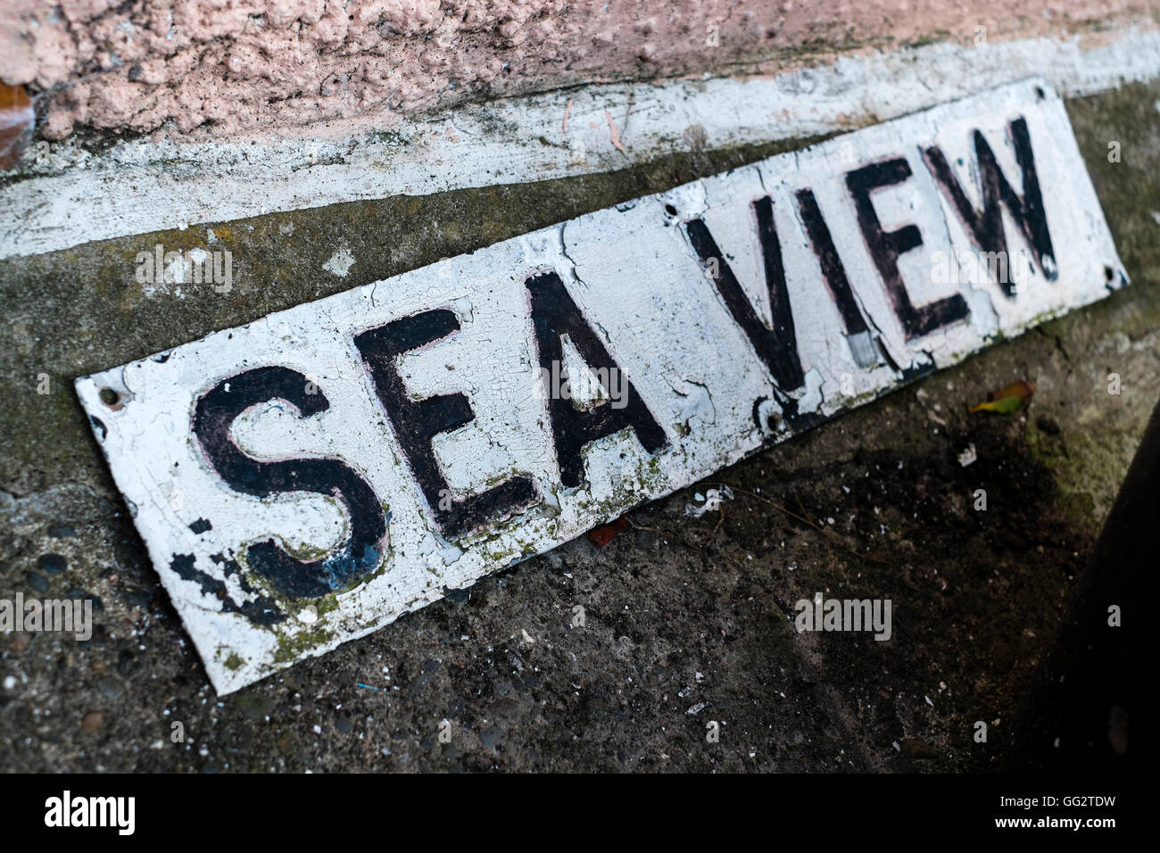 A dilapidated Sea View sign, originally off the wall of a house Stock Photo