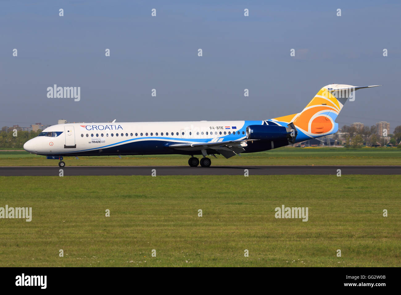 Amsterdam/Netherland April 9, 2016: Fokker 70 from TRADE AIR taxing at Amsterdam Airport Stock Photo