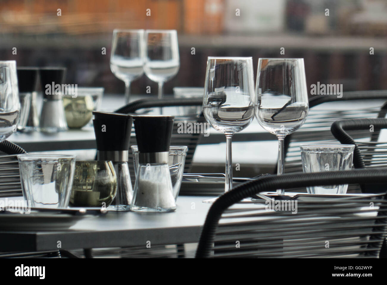 table with empty glasses and accessories for dining Stock Photo - Alamy
