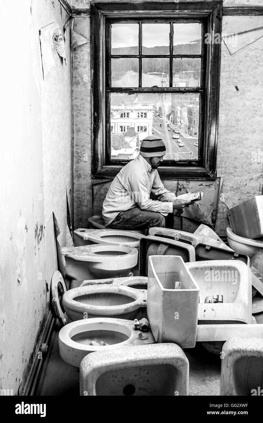 Man on toilet reading book hires stock photography and images Alamy