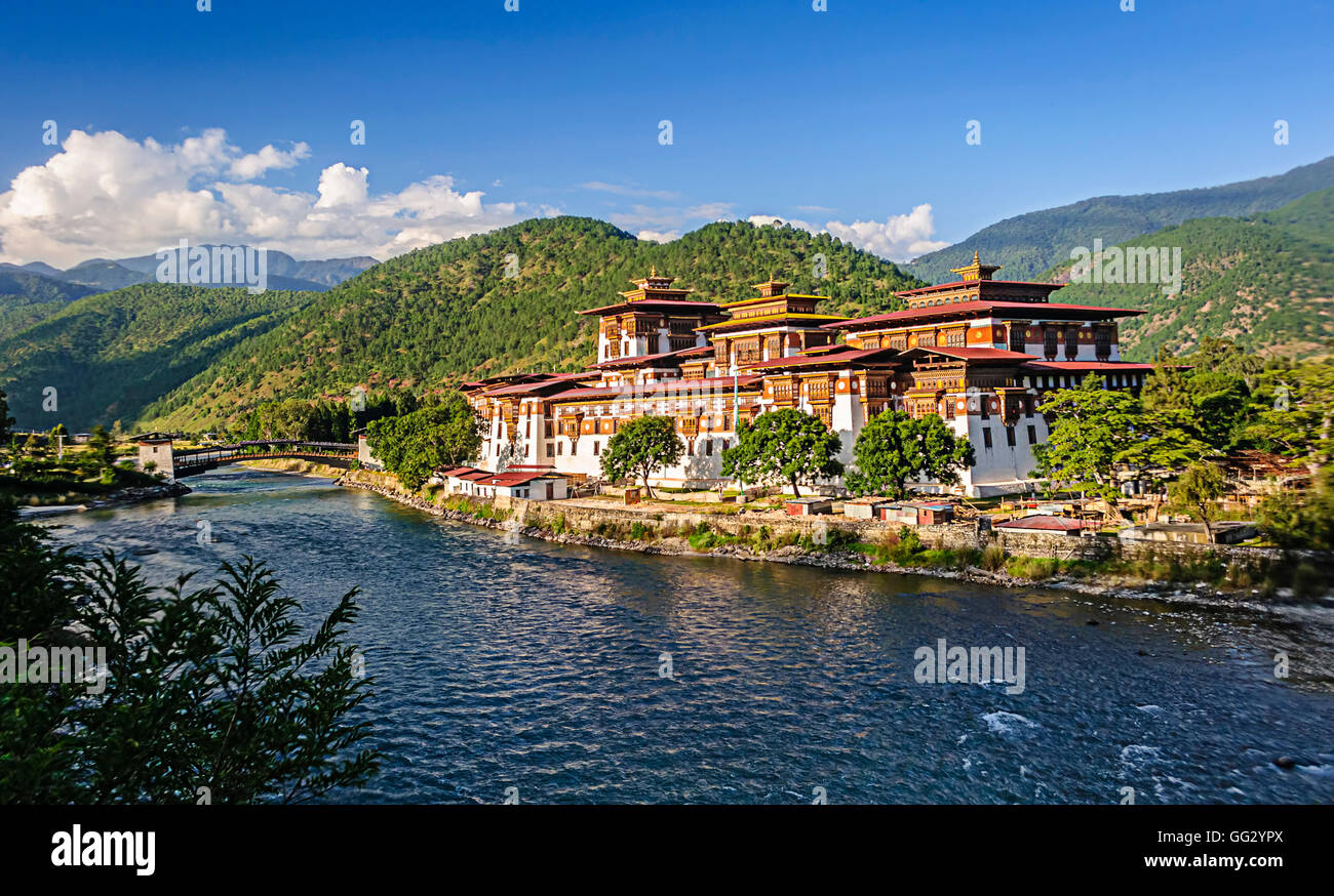 Punakha Dzong, Fortress of Bhutan, confluence of two flowing blue river and backdrop of green Himalayan mountains, copy space Stock Photo