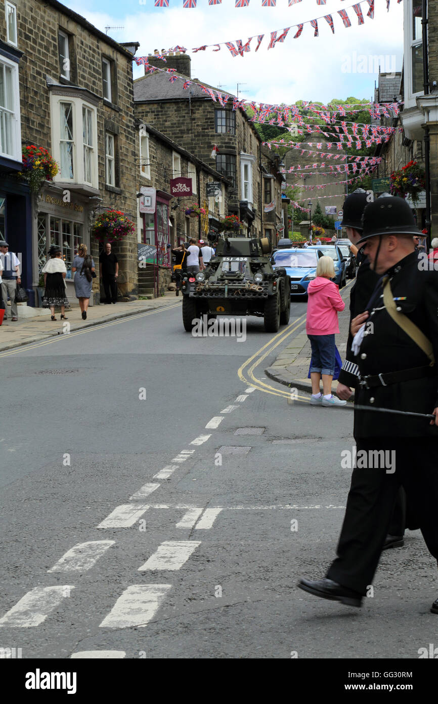 Armoured car and policemen as part of the 1940s weekend in High Street, Pateley Bridge, North Yorkshire, England, United Kingdom Stock Photo