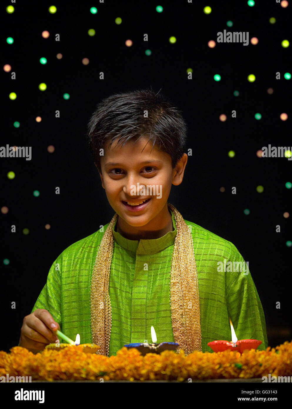 Boy lighting Diya Stock Photo Alamy