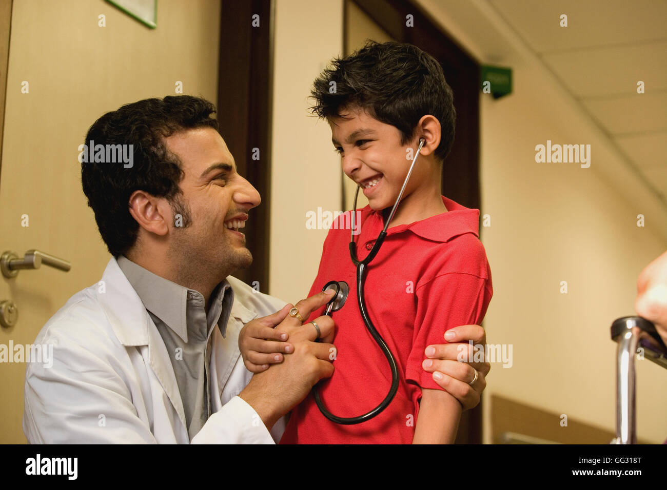 Doctor having fun with his patient Stock Photo