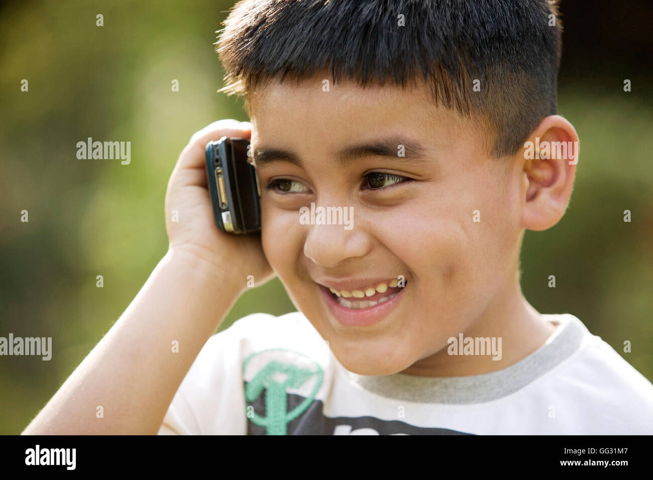 Boy talking on a phone Stock Photo