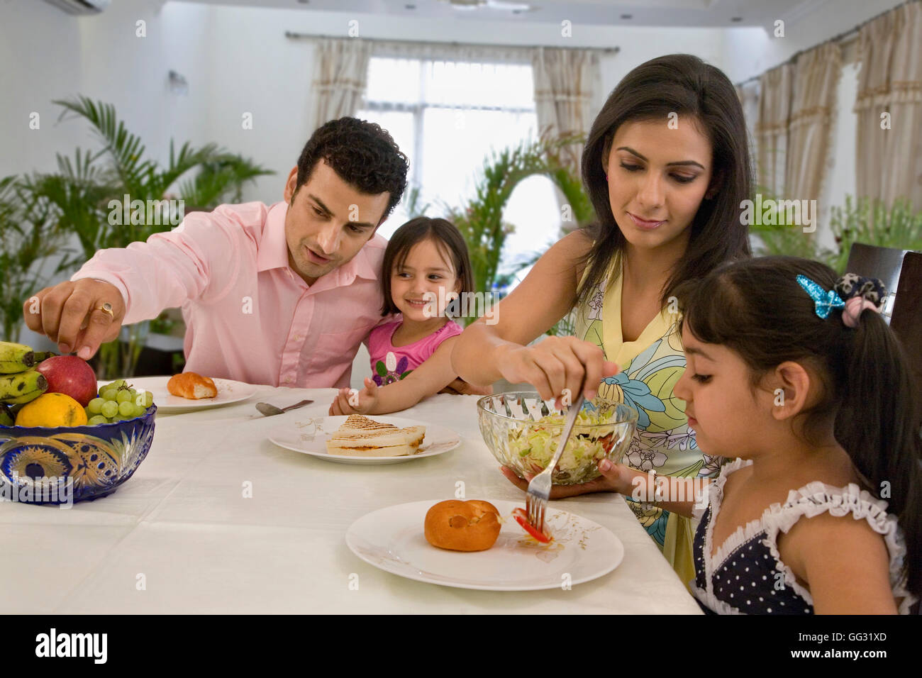 Family at the breakfast table Stock Photo - Alamy