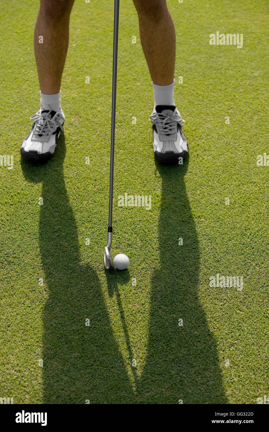 Golfer about to tee off Stock Photo Alamy