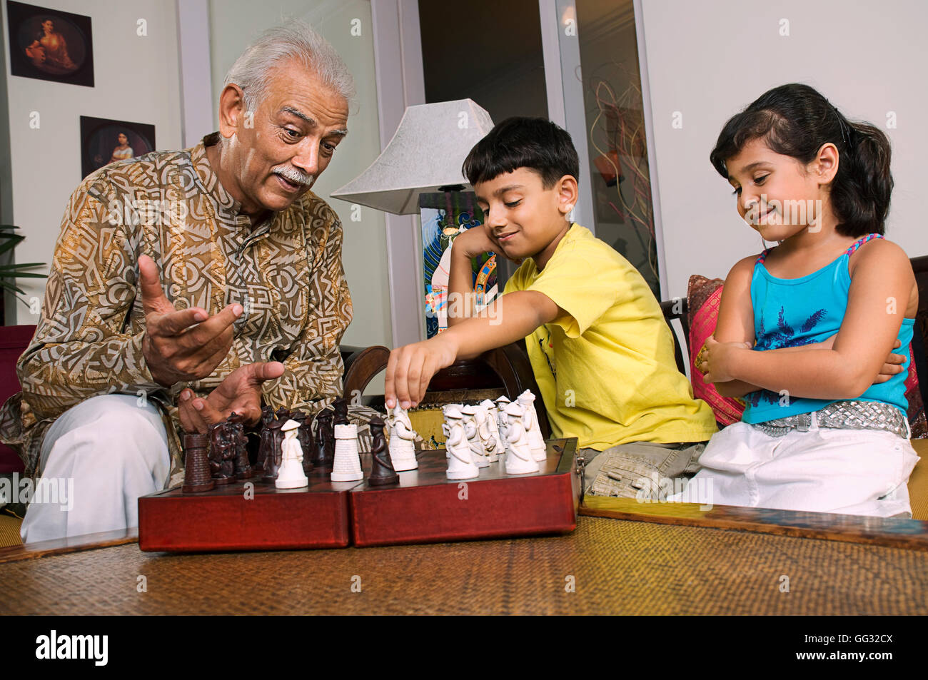 Grandfather playing with grandchildren Stock Photo