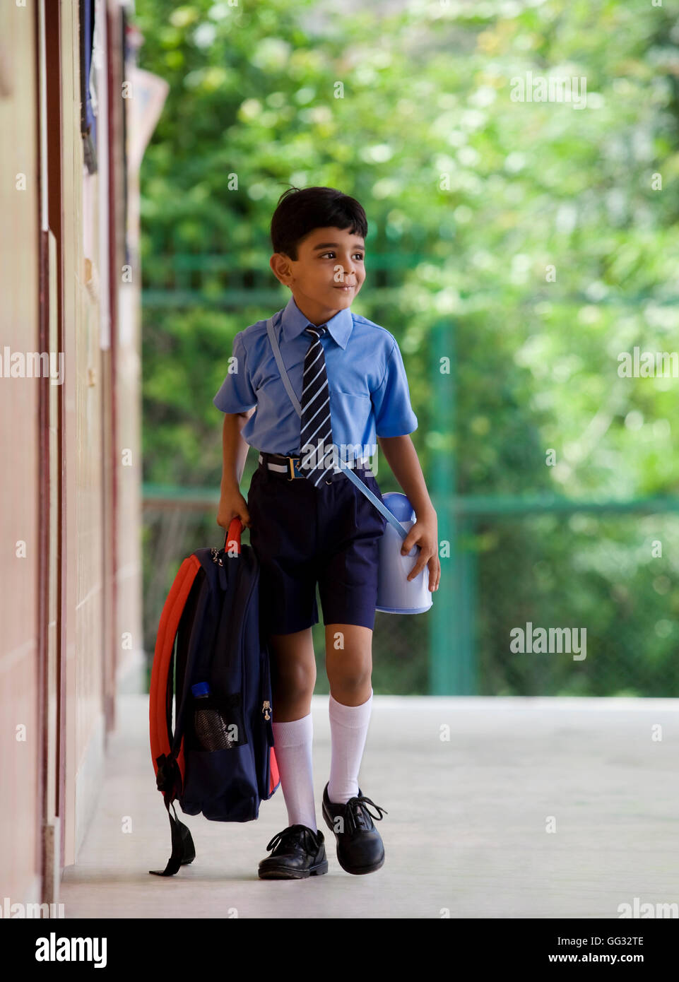 School boy with a school bag Stock Photo - Alamy