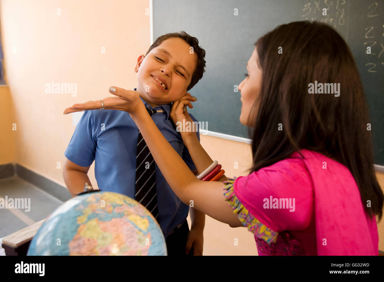 Teacher punishing a student Stock Photo