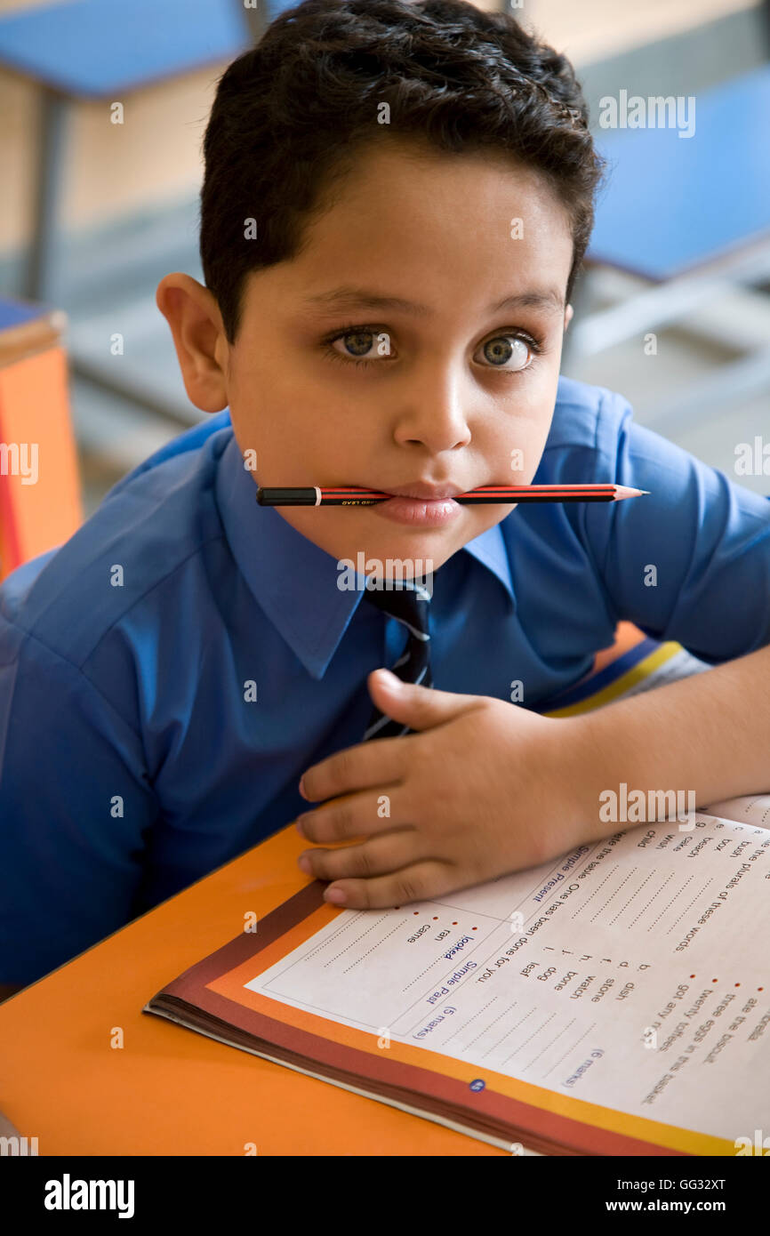School boy at his desk Stock Photo Alamy