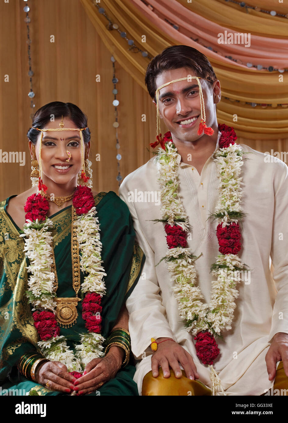 Portrait of just married Maharashtrian couple smiling together Stock Photo