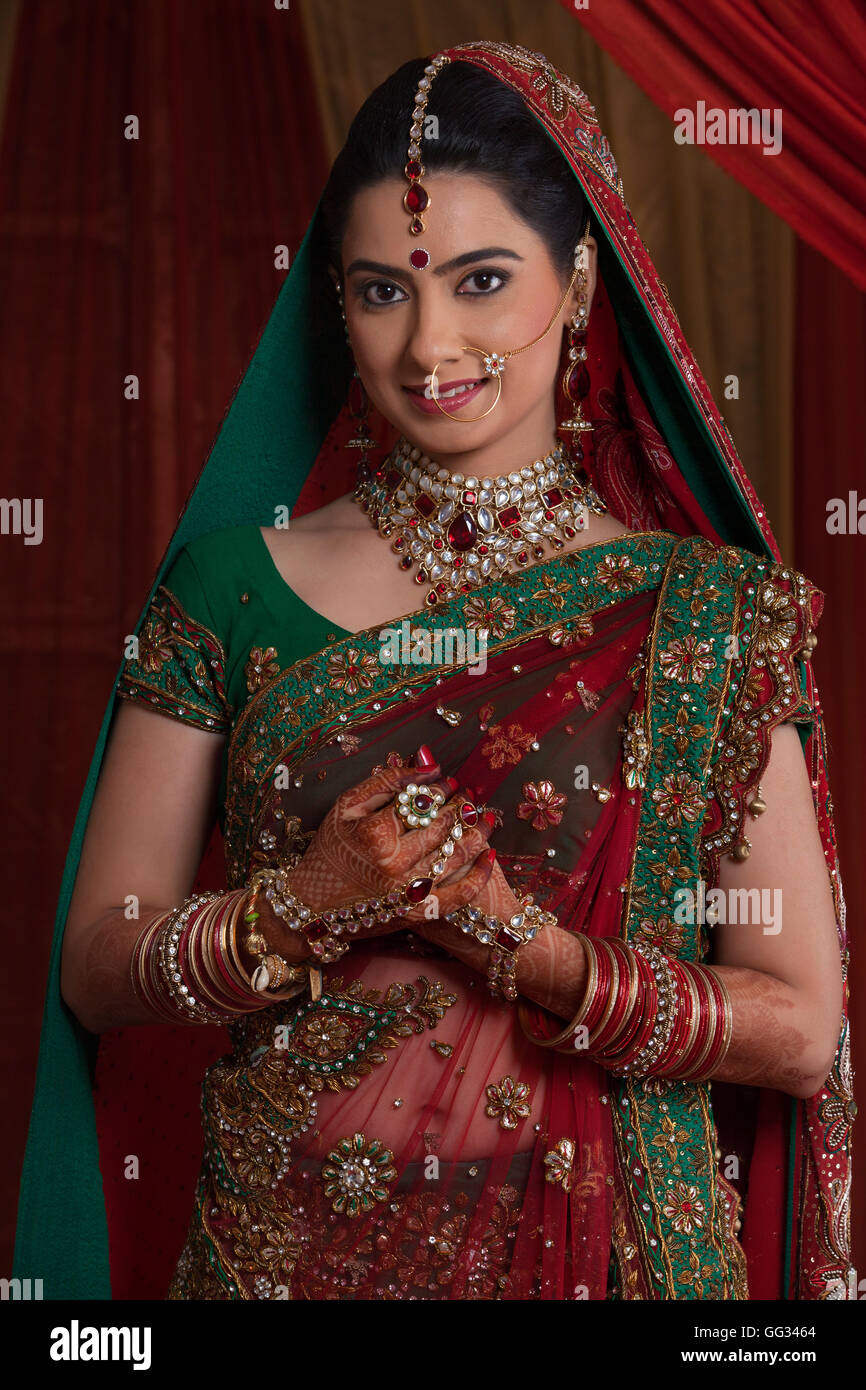 Portrait of beautiful young bride in traditional outfit Stock Photo - Alamy