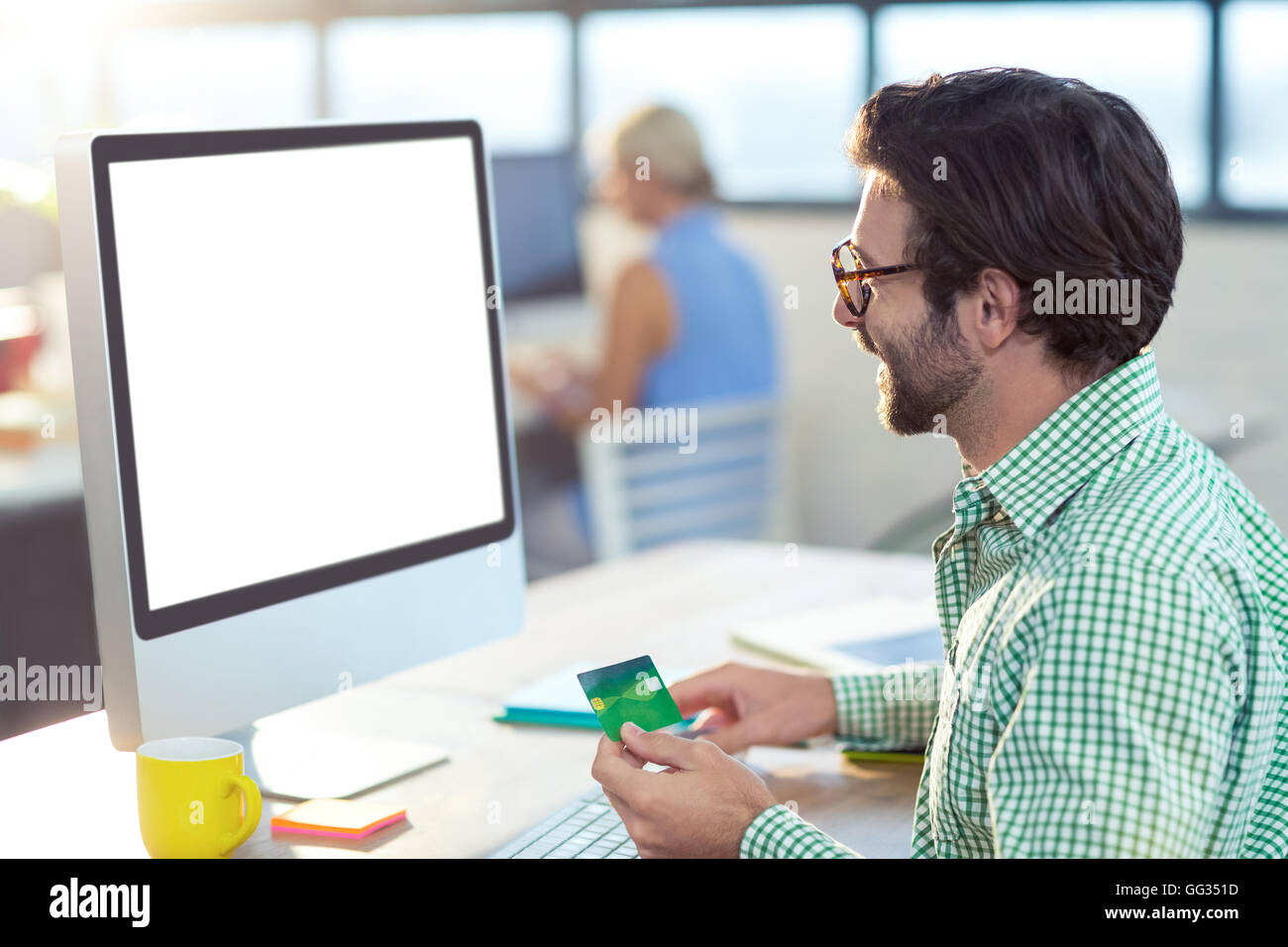Graphic designer doing online shopping Stock Photo Alamy