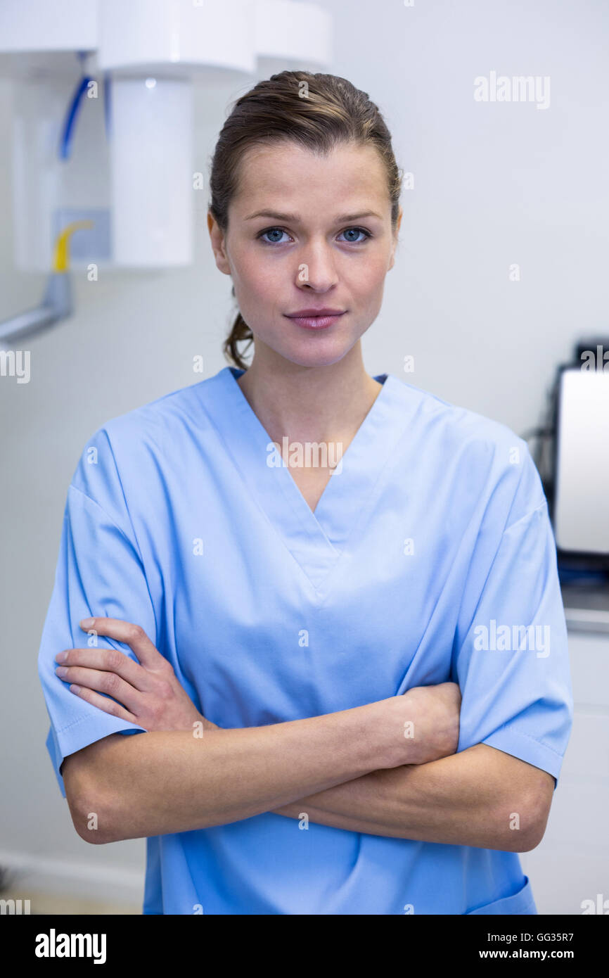 Portrait of dental assistant standing with arms crossed Stock Photo