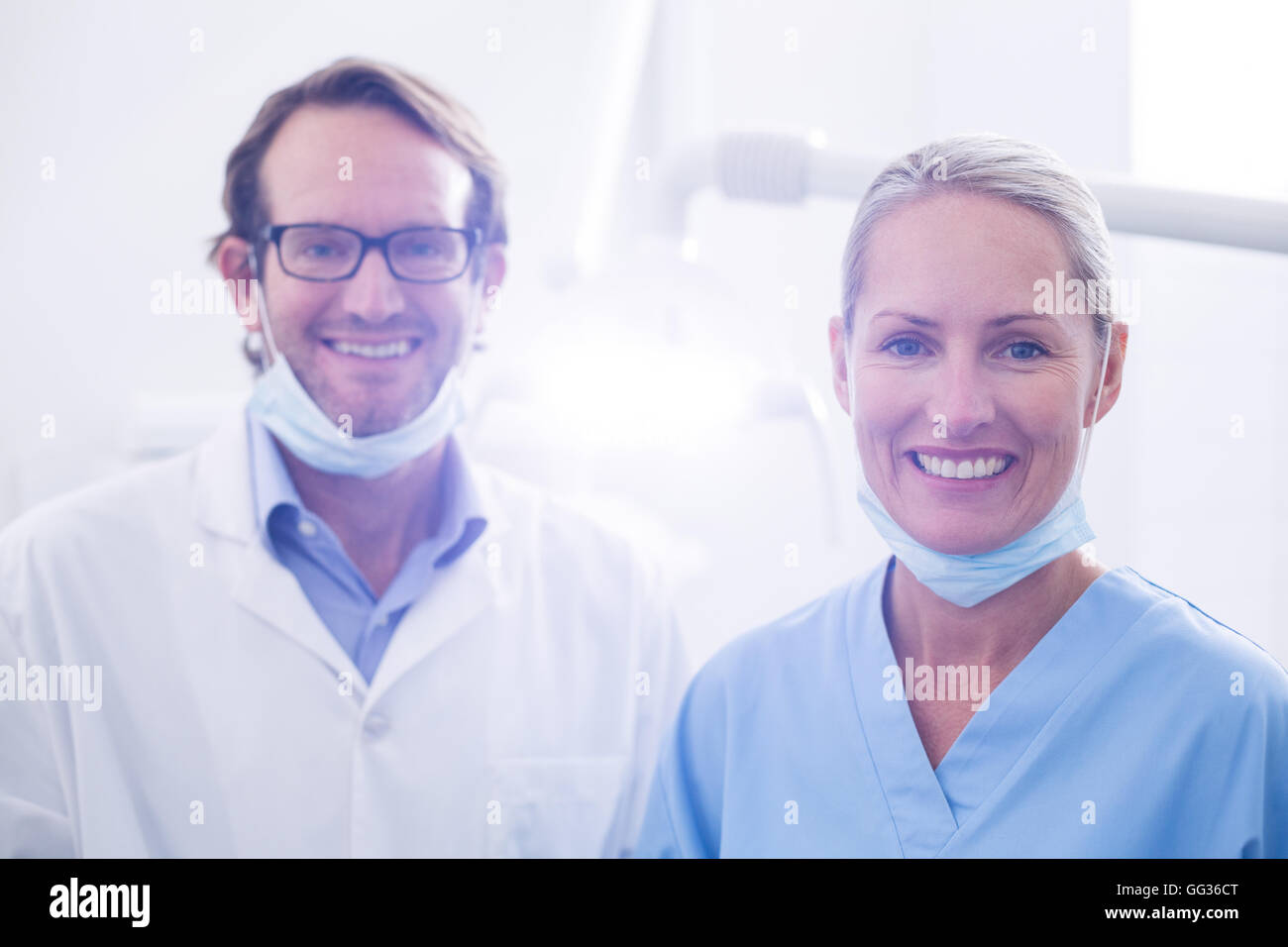 Portrait of dental assistant and dentist wearing surgical mask Stock Photo