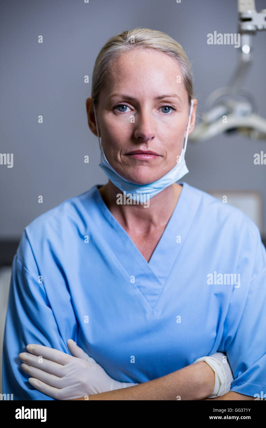 Dental assistant standing with arm crossed in clinic Stock Photo Alamy