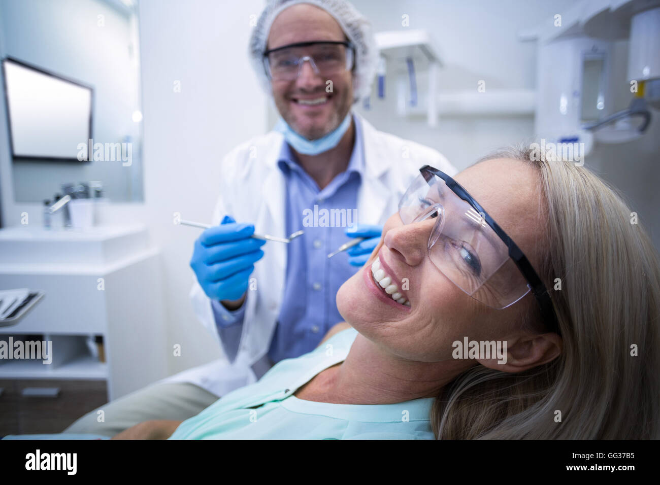 Female patient smiling while getting treatment Stock Photo