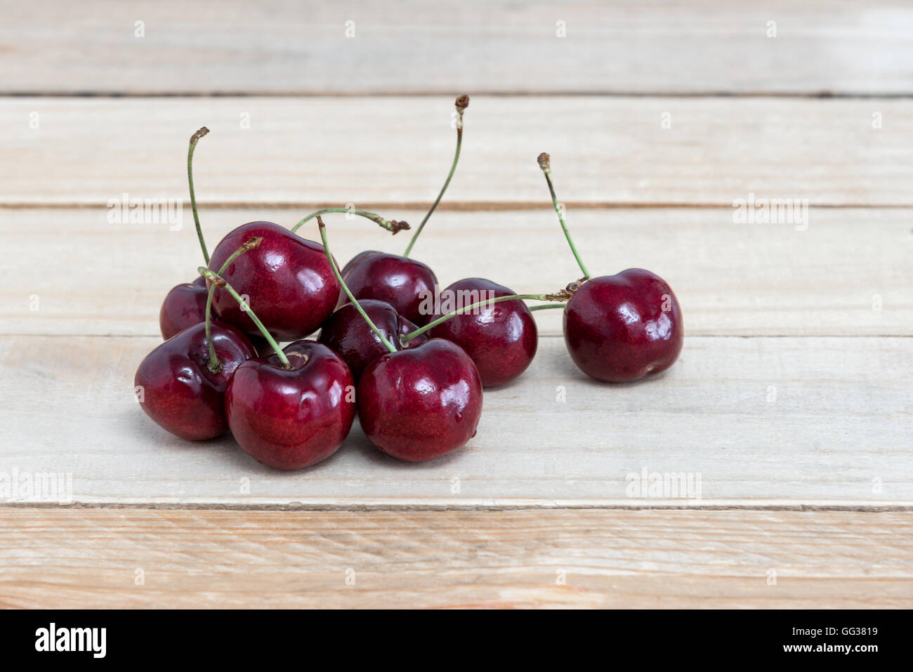 Sweet fresh cherry on wooden Stock Photo