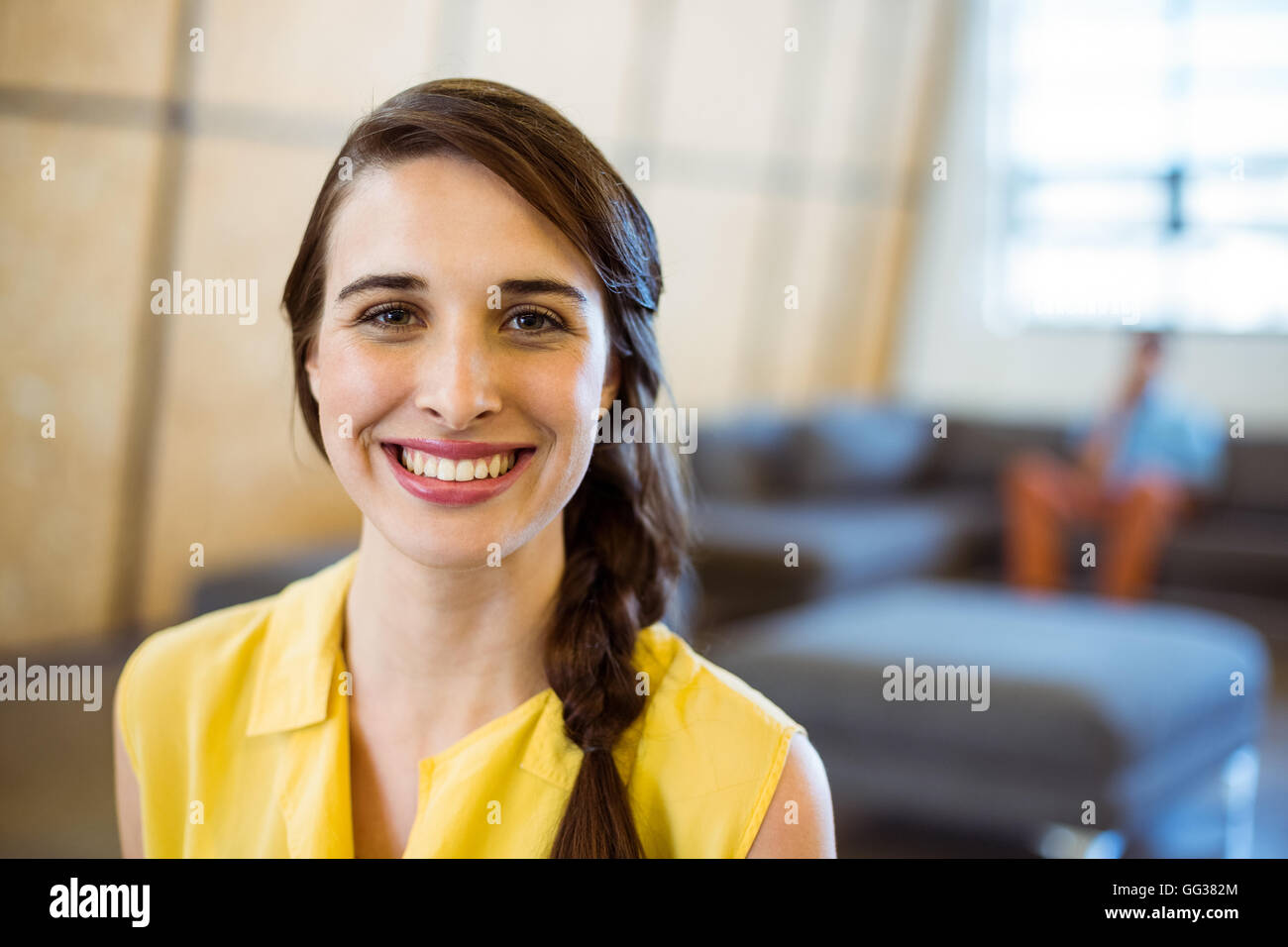Portrait of female business executive smiling Stock Photo - Alamy