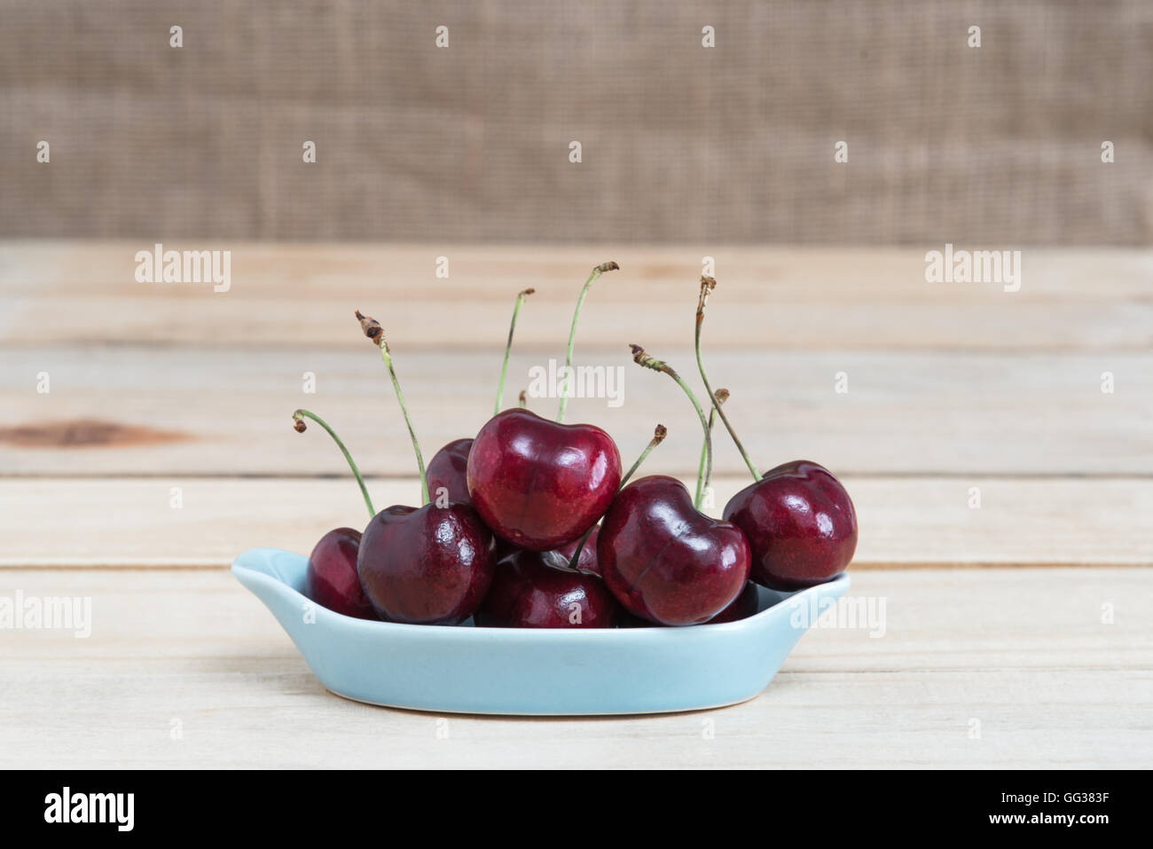 Sweet fresh cherry on wooden Stock Photo