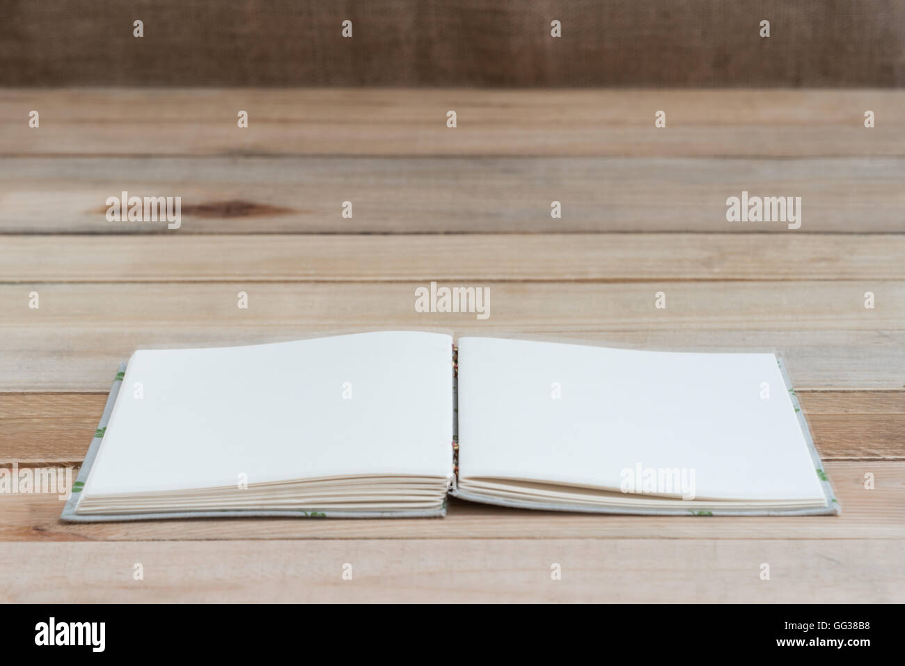 open book with blank pages on wood table Stock Photo