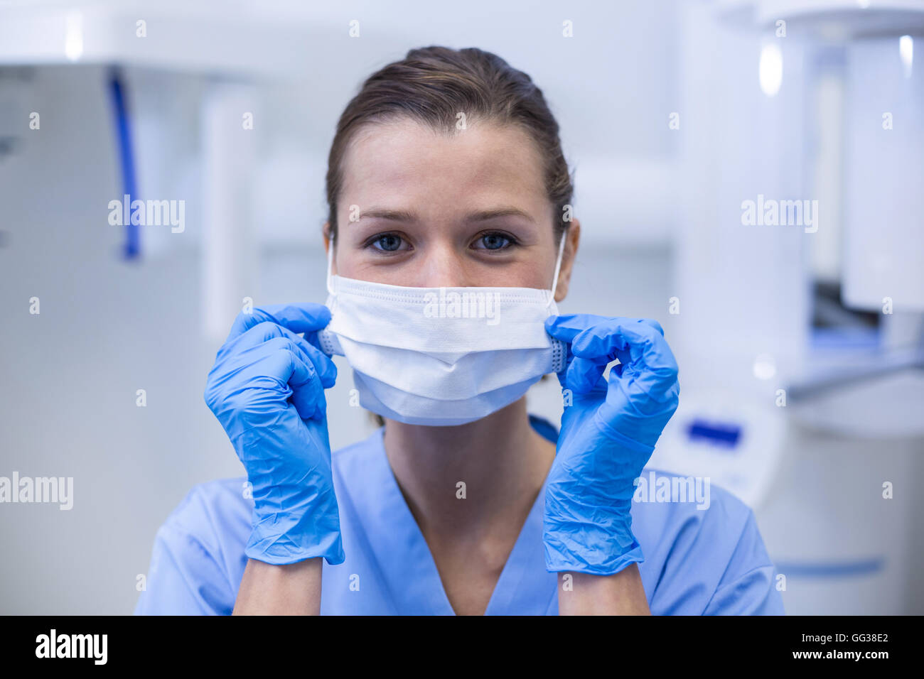 Dental assistant wearing surgical mask in dental clinic Stock Photo Alamy