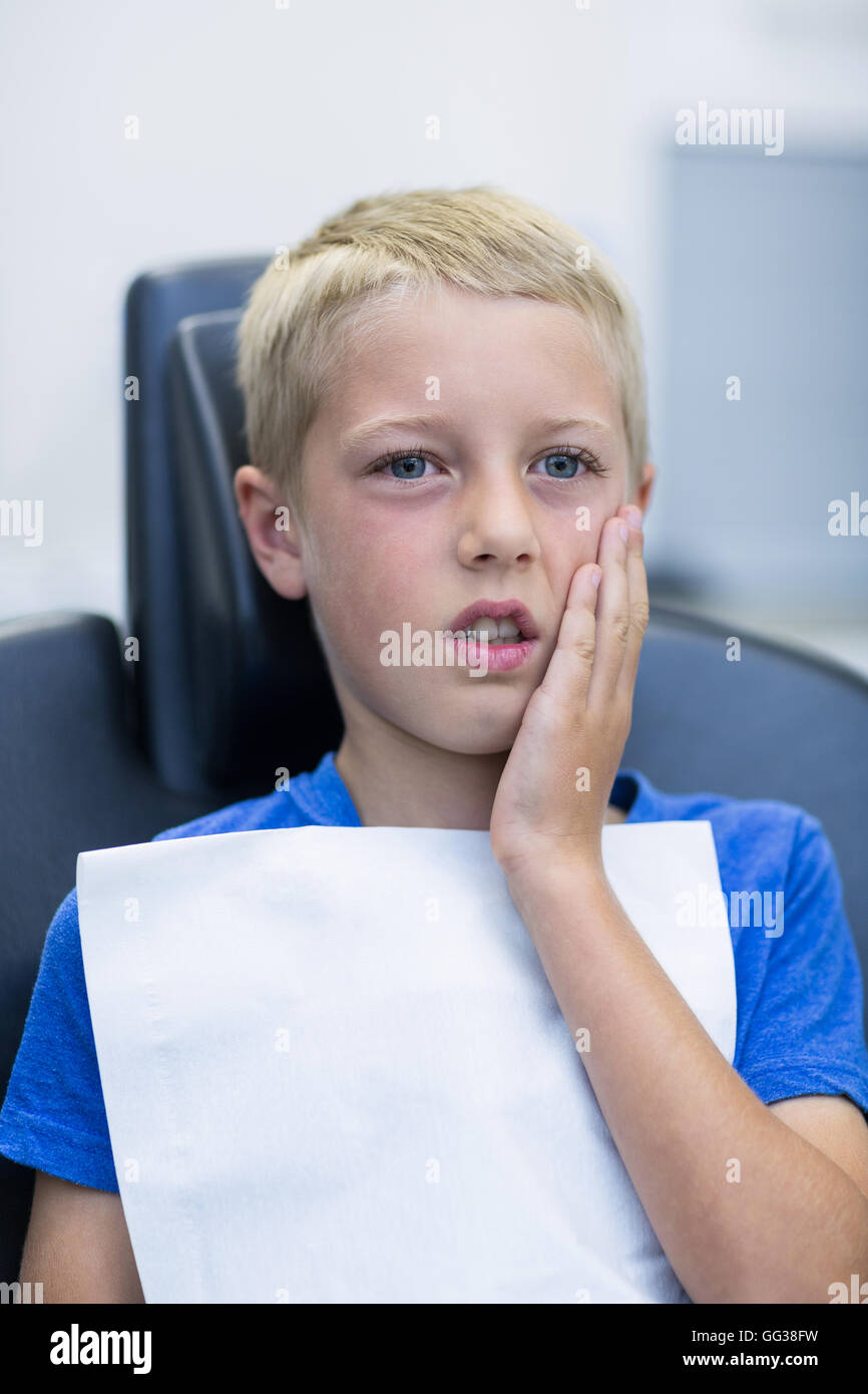 Unhappy young patient having a toothache Stock Photo