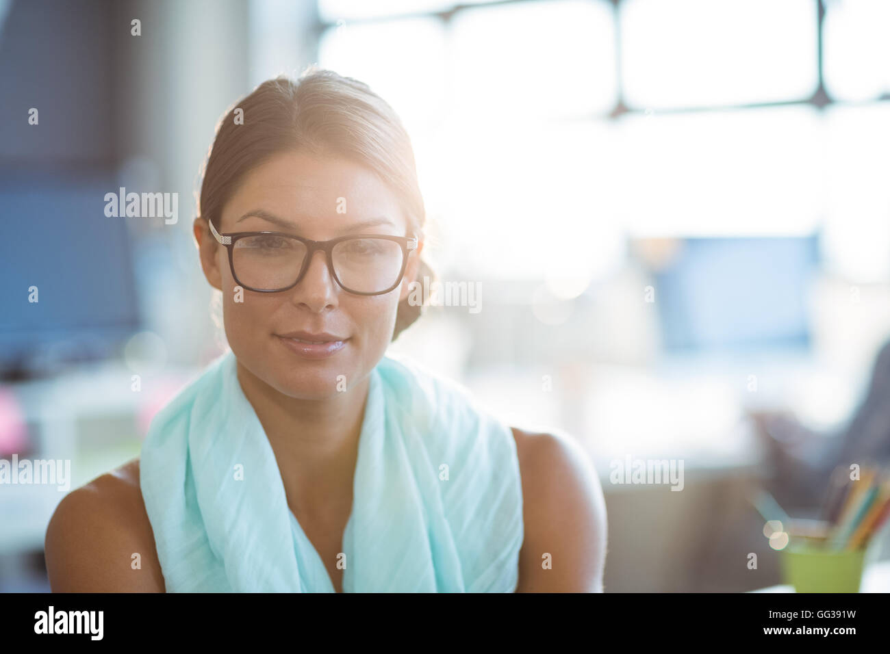 Business executive smiling in office Stock Photo - Alamy
