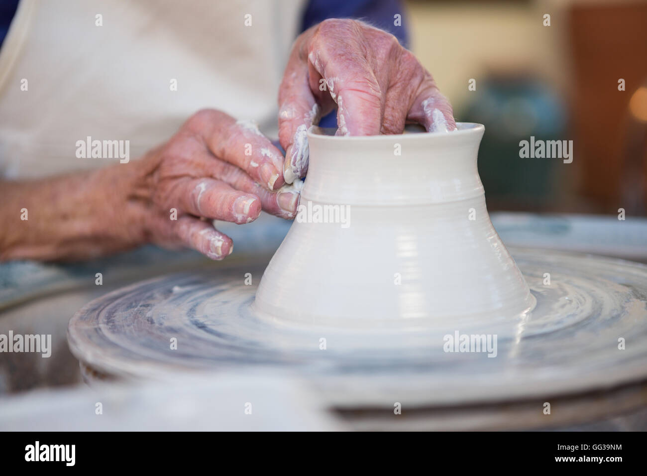 Mid section of potter making pot Stock Photo Alamy