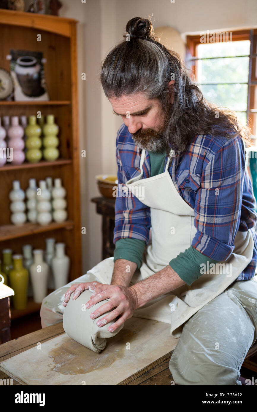 Attentive Senior Man Molding Clay Stock Photo - Image of paint, occupation:  99904544