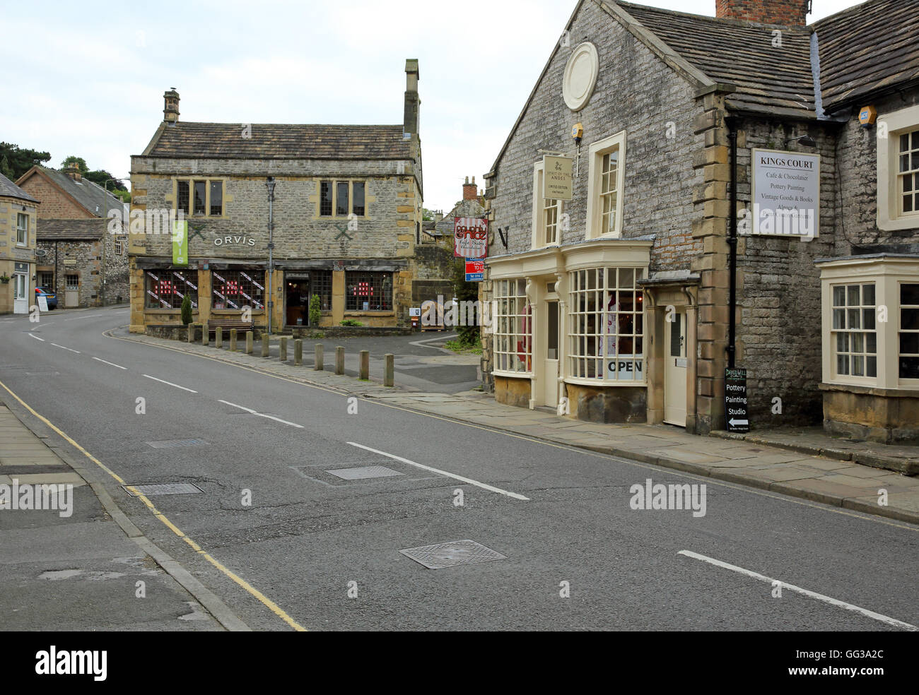 Shops in traditional stone buildings in the ancient Market town of Bakewell, Derbyshire, England. Stock Photo