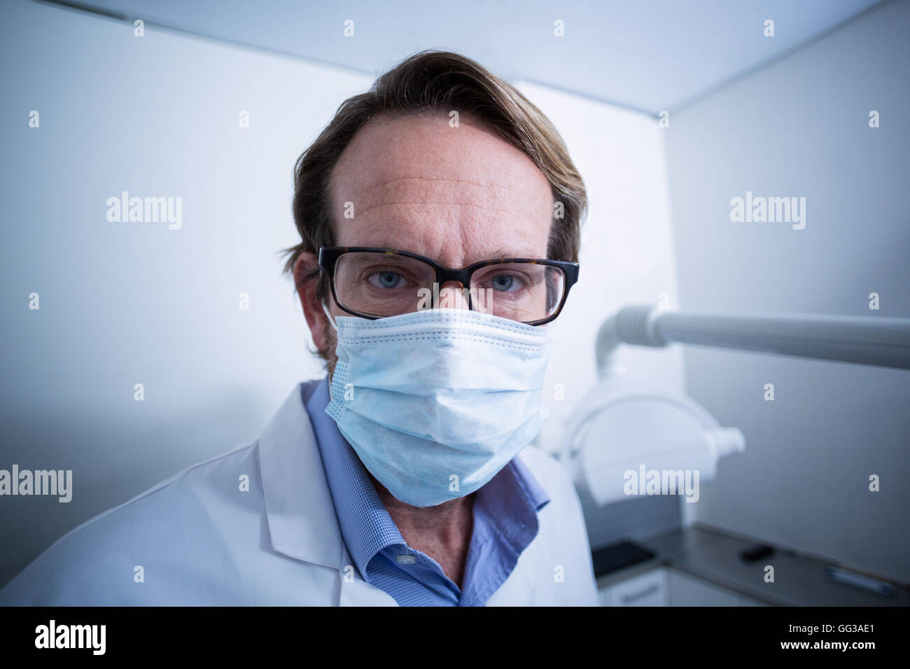 Portrait of dentist wearing surgical mask Stock Photo