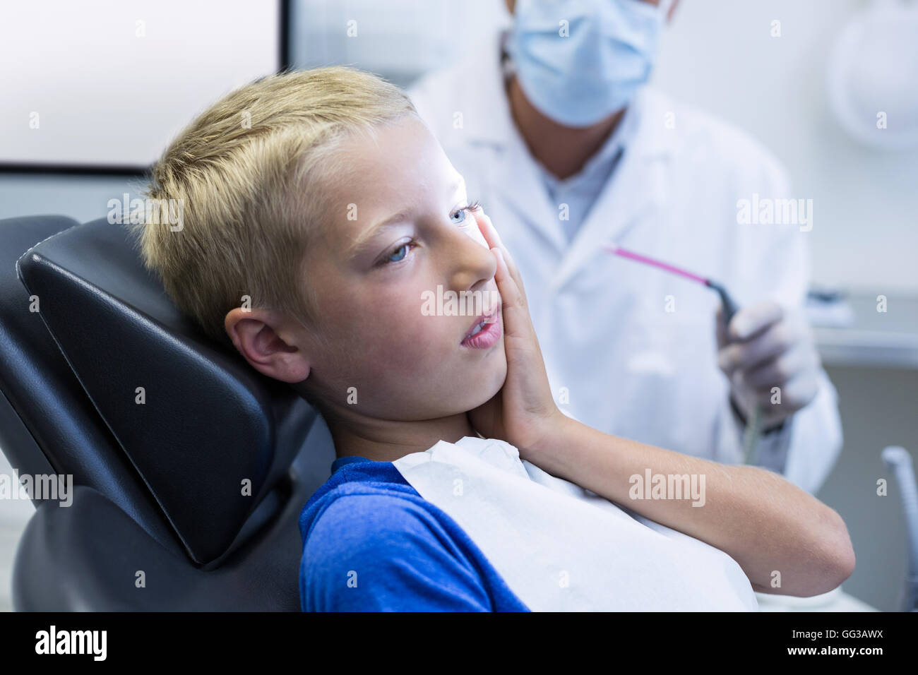 Unhappy young patient having a toothache Stock Photo