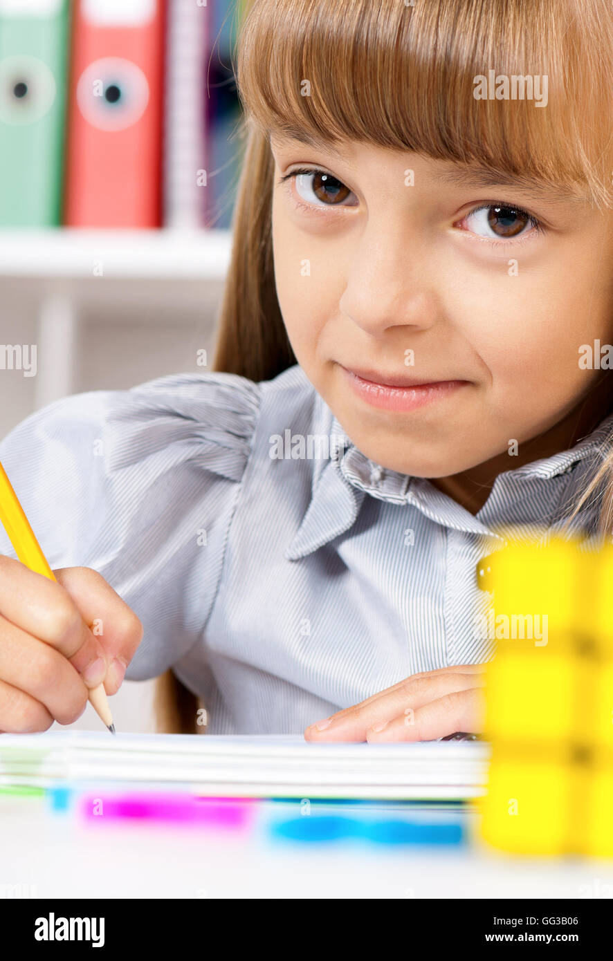 Happy girl in school Stock Photo - Alamy