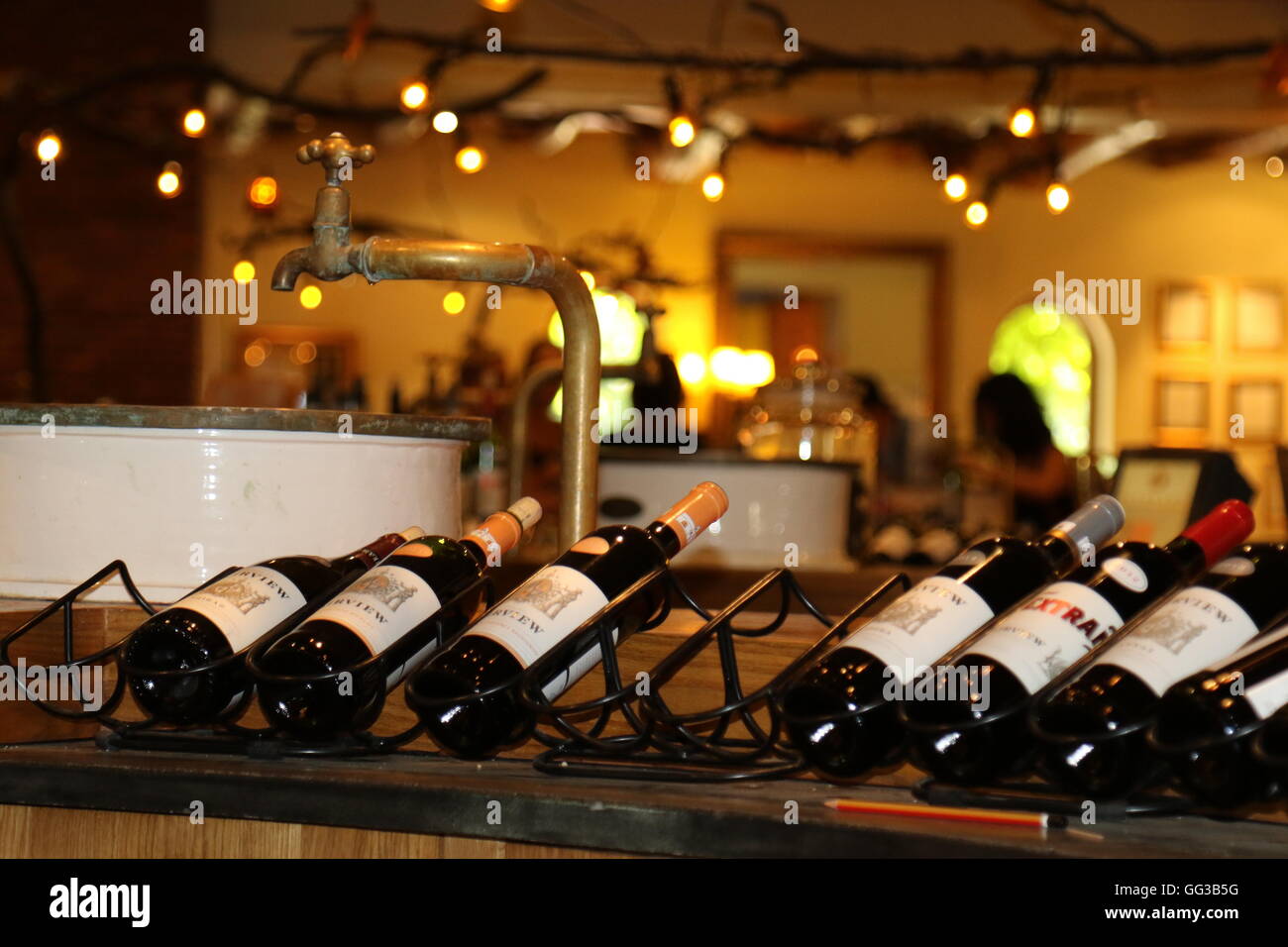 Bottles on a rack on display at a wine tasting cellar door at Fairview Wines in Paar region in