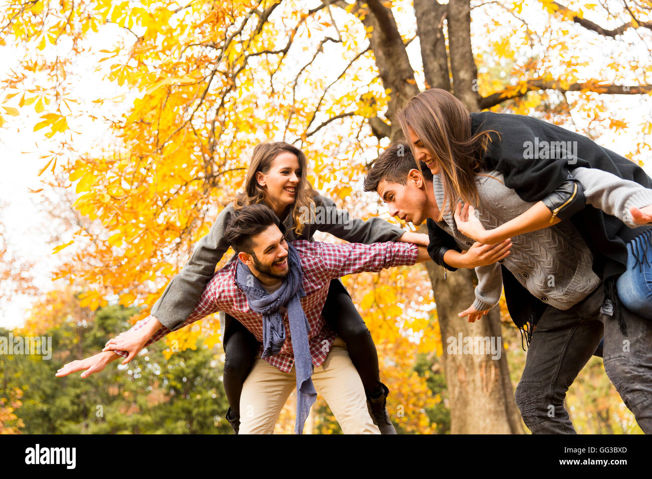 Young people having fun in the autumn park Stock Photo