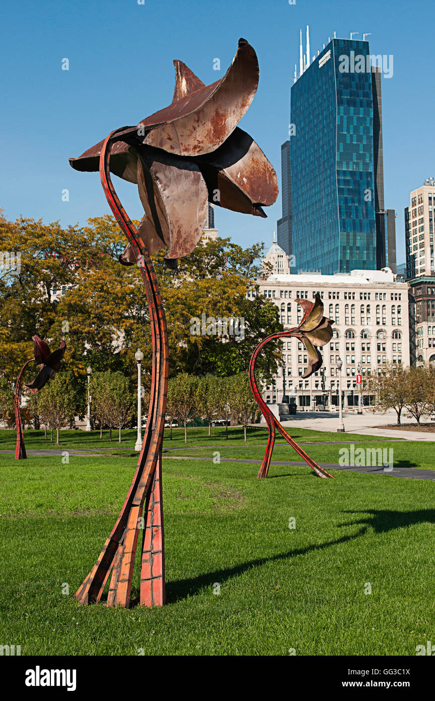 Metal flower sculptures in Grant Park, for artists and automobiles exhibit in Chicago. Pieces were made using scrap from automob Stock Photo