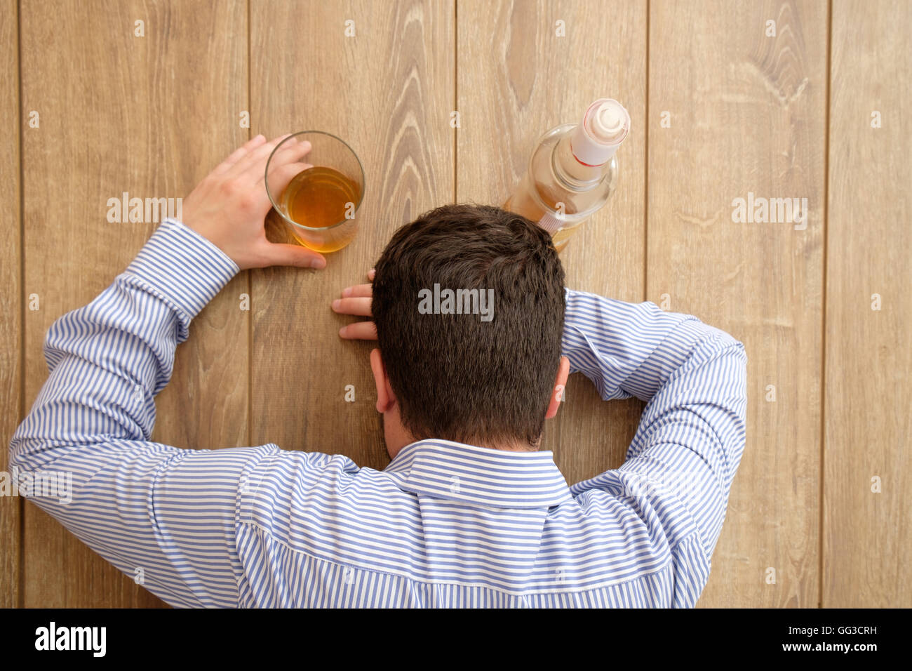 Man alcohol addicted feeling bad Stock Photo