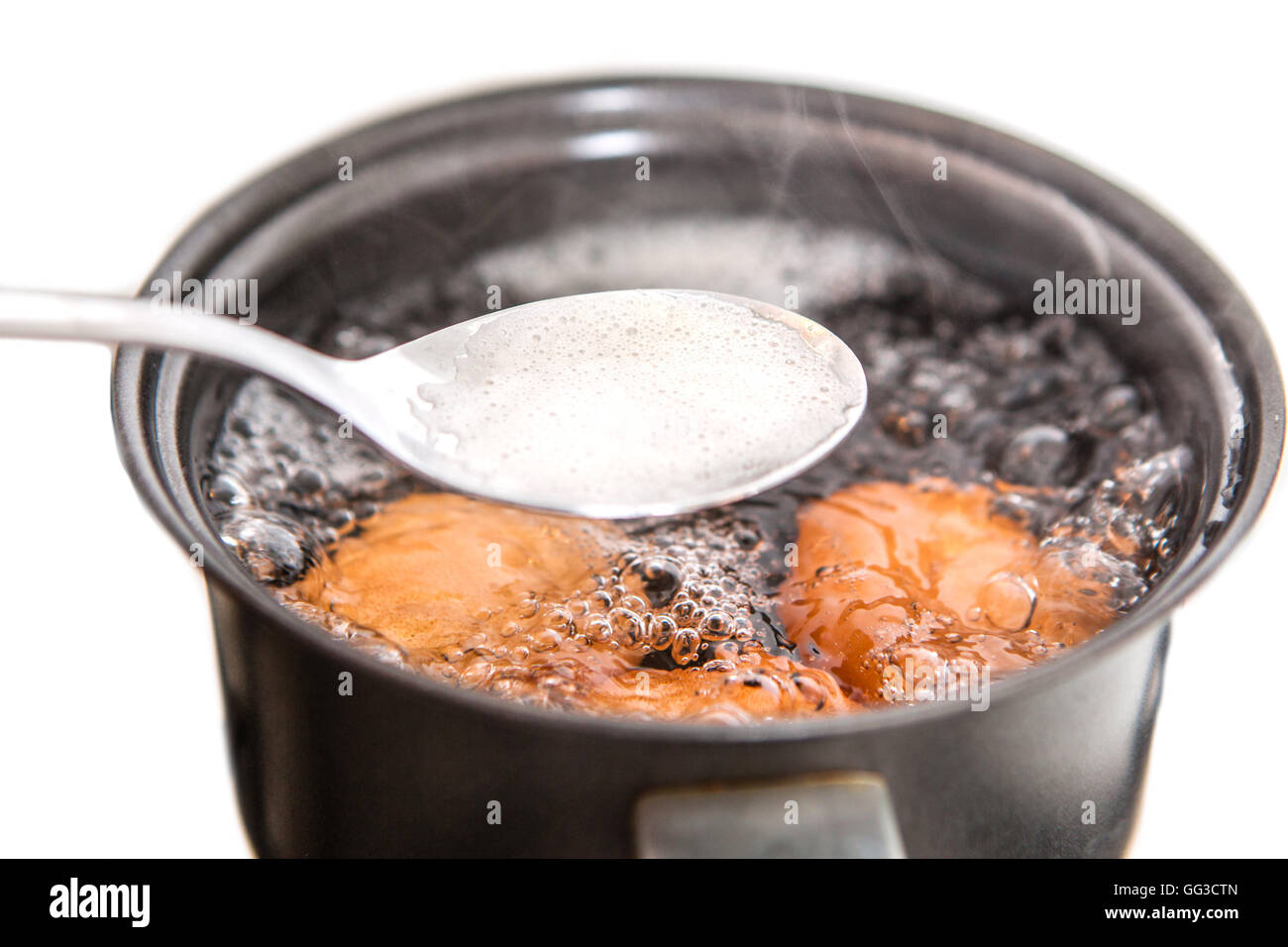 Closeup of three eggs boiling in pot hot water Stock Photo Alamy